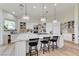 Kitchen boasts a large central island with a marble countertop and a bar seating at 2345 Villandry Ct, Henderson, NV 89074