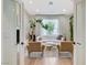 A well-decorated living room features a white sofa and two armchairs in front of a window at 2345 Villandry Ct, Henderson, NV 89074