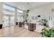 Airy living room featuring tall windows, stylish furnishings, and access to the outdoor space at 2345 Villandry Ct, Henderson, NV 89074