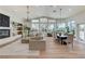 Bright and airy living room featuring a fireplace, built-in shelves, and an oversized sectional sofa at 2345 Villandry Ct, Henderson, NV 89074