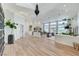 Bright, open-concept living room with modern decor, high ceilings, and large windows at 2345 Villandry Ct, Henderson, NV 89074