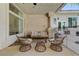 Covered patio area has a seating area and overlooks the backyard at 2345 Villandry Ct, Henderson, NV 89074