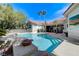 Relaxing backyard pool and spa with mature trees offers a private and peaceful outdoor oasis at 2345 Villandry Ct, Henderson, NV 89074
