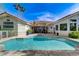 Clean pool design with lush tropical landscaping creating a backyard paradise at 2345 Villandry Ct, Henderson, NV 89074