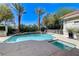 Sparkling pool and spa with stone waterfall and ample deck space, ideal for relaxation and outdoor enjoyment at 2345 Villandry Ct, Henderson, NV 89074