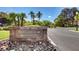Stone sign marks the entrance to Prometheus Ct. and Caserta Ct. with lush landscaping at 2345 Villandry Ct, Henderson, NV 89074