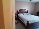 Relaxing bedroom with a dark wood bed frame and tile flooring at 2349 Cardiff Ln # B, Las Vegas, NV 89108