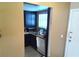 Bright kitchen nook with granite countertops, dark cabinets, and lots of natural light at 2349 Cardiff Ln # B, Las Vegas, NV 89108
