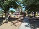 Community pool surrounded by mature trees and landscape at 2349 Cardiff Ln # B, Las Vegas, NV 89108
