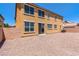 Spacious backyard features a rock surface and brick wall at 2521 Cattrack Ave, North Las Vegas, NV 89081