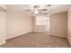 Spacious bedroom with neutral carpet, ceiling fan, and a bright ambiance at 2521 Cattrack Ave, North Las Vegas, NV 89081