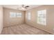 Bedroom featuring neutral walls, carpet, and natural light from two windows at 2521 Cattrack Ave, North Las Vegas, NV 89081