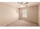 Bedroom featuring neutral carpet, ceiling fan, and a bright ambiance at 2521 Cattrack Ave, North Las Vegas, NV 89081