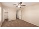 Bedroom featuring neutral carpet, ceiling fan, and a bright ambiance at 2521 Cattrack Ave, North Las Vegas, NV 89081