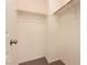 Walk-in closet featuring built-in shelving and a view of the carpeted floor at 2521 Cattrack Ave, North Las Vegas, NV 89081