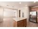 Open kitchen with an island, stainless steel appliances, and a view into the adjacent living area at 2521 Cattrack Ave, North Las Vegas, NV 89081