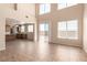 Open-concept living room featuring high ceilings and sliding glass doors to the backyard at 2521 Cattrack Ave, North Las Vegas, NV 89081