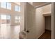 Bright and airy living room with tile flooring and windows overlooking the backyard at 2521 Cattrack Ave, North Las Vegas, NV 89081