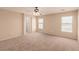 Open main bedroom with carpet and neutral tones throughout the room at 2521 Cattrack Ave, North Las Vegas, NV 89081