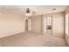 Large carpeted main bedroom with ceiling fan and an ensuite bathroom at 2521 Cattrack Ave, North Las Vegas, NV 89081