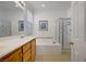 Bathroom with a large soaking tub, shower, and double vanity at 2851 Glistening Grove Ave, Henderson, NV 89052