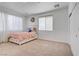 Bright bedroom with carpet, a bed, curtains, and closet space at 2851 Glistening Grove Ave, Henderson, NV 89052