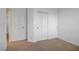 Empty bedroom featuring wall-to-wall carpeting, a closet, and ample space at 2851 Glistening Grove Ave, Henderson, NV 89052
