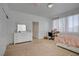 Bright bedroom with white furniture, plush carpet, and natural light from the window at 2851 Glistening Grove Ave, Henderson, NV 89052