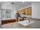 Spacious kitchen with wooden cabinets, stainless steel appliances, and granite countertops at 2851 Glistening Grove Ave, Henderson, NV 89052