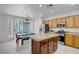 Modern kitchen with a center island, stainless steel appliances, and abundant counter space at 2851 Glistening Grove Ave, Henderson, NV 89052