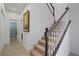 Carpeted staircase with white spindles and wooden handrail, leading to the upper level at 2851 Glistening Grove Ave, Henderson, NV 89052