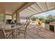 A covered patio with furniture overlooks a spa and desert landscaping at 3071 Lake Barkley Rd, Henderson, NV 89052