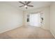 Bedroom with neutral carpet, ceiling fan, and abundant natural light at 3071 Lake Barkley Rd, Henderson, NV 89052