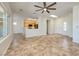 Open-concept living area with tile flooring leading to an eat-in kitchen with oak cabinets at 3071 Lake Barkley Rd, Henderson, NV 89052