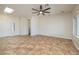 Bright, open living area with tile flooring, ceiling fan, and ample natural light at 3071 Lake Barkley Rd, Henderson, NV 89052