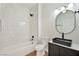 Contemporary bathroom with a black vanity, sleek mirror, and tiled shower over tub at 3318 N Decatur Blvd # 1107, Las Vegas, NV 89130