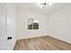 Bright bedroom with wood-look floors, window view, and fresh paint at 3318 N Decatur Blvd # 1107, Las Vegas, NV 89130