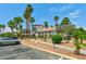 Well-maintained property with ample parking, manicured landscaping, and mature palm trees enhances curb appeal at 3318 N Decatur Blvd # 1107, Las Vegas, NV 89130