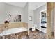Bathroom featuring a soaking tub, a toilet, and access to the shower room and bedroom at 360 E Desert Inn Rd # 1803, Las Vegas, NV 89109