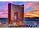 Exterior shot of the Encore hotel at sunset, captured from a high vantage point, offering stunning city views at 360 E Desert Inn Rd # 1803, Las Vegas, NV 89109