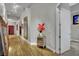 Elegant hallway featuring hardwood floors, sophisticated decor, and access to various rooms at 360 E Desert Inn Rd # 1803, Las Vegas, NV 89109