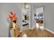 Inviting hallway showcasing hardwood floors, stylish decor, and views into the bedroom and living area at 360 E Desert Inn Rd # 1803, Las Vegas, NV 89109