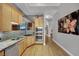 Bright kitchen featuring stainless steel appliances, granite countertops and natural wood flooring at 360 E Desert Inn Rd # 1803, Las Vegas, NV 89109