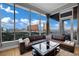 A bright living room with floor-to-ceiling windows offering incredible city views and ample natural light at 360 E Desert Inn Rd # 1803, Las Vegas, NV 89109