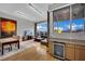 Open floor plan featuring a modern kitchen, dining room, living room, with city views from large windows at 360 E Desert Inn Rd # 1803, Las Vegas, NV 89109