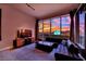 The living room with modern furniture boasts breathtaking city views with floor to ceiling windows at 360 E Desert Inn Rd # 1803, Las Vegas, NV 89109
