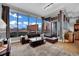 Bright living room with panoramic city views, a comfortable sofa, and access to an outdoor balcony at 360 E Desert Inn Rd # 1803, Las Vegas, NV 89109