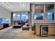 Living room features floor-to-ceiling windows with city views, hardwood flooring, and modern furnishings at 360 E Desert Inn Rd # 1803, Las Vegas, NV 89109