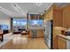Open floor plan featuring a modern kitchen, living room with floor-to-ceiling windows, and city views at 360 E Desert Inn Rd # 1803, Las Vegas, NV 89109