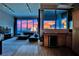 The great room opens to a full bar with panoramic city views through expansive windows at 360 E Desert Inn Rd # 1803, Las Vegas, NV 89109